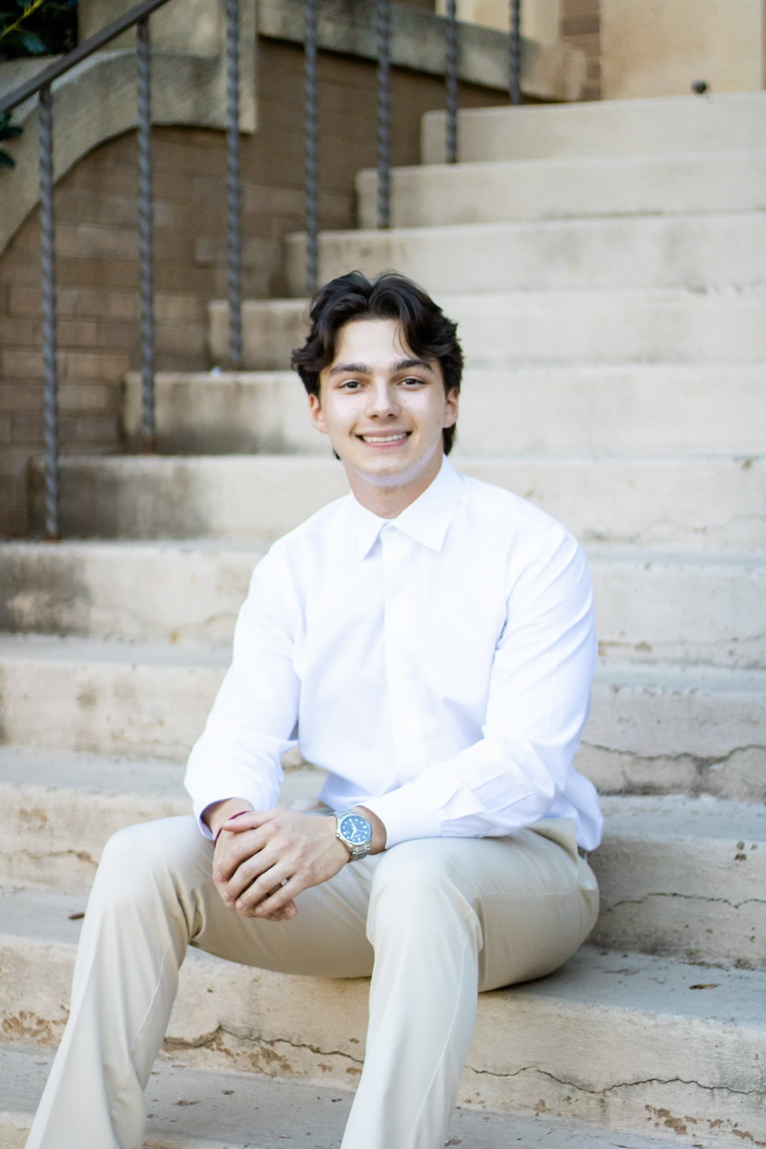 Evan Perkins standing on an outdoor staircase